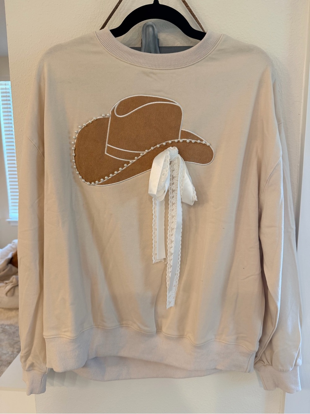Cream Pullover Sweatshirt with Brown Cowboy Hat Applique